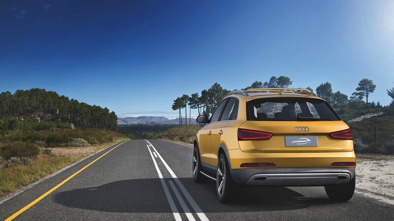 Yellow Audi on a scenic road