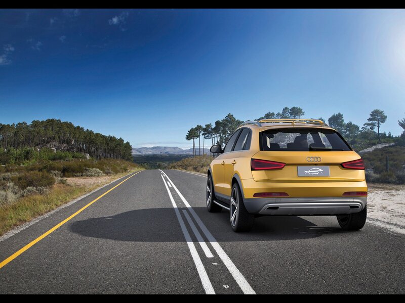 Yellow Audi on a scenic road