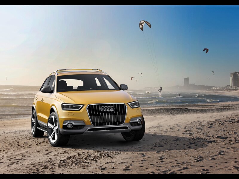 Yellow Audi on the beach