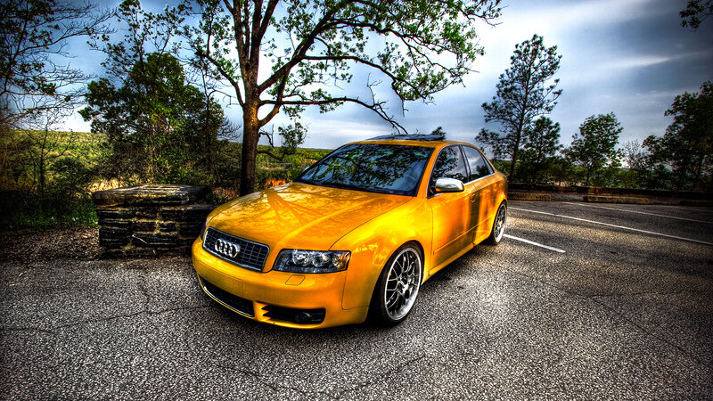 yellow audi parked on road