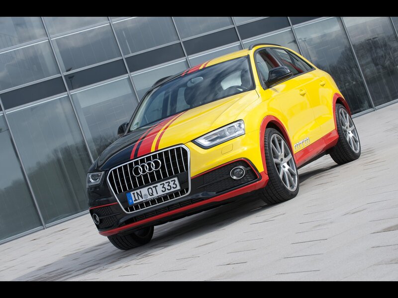 yellow audi q3 with racing stripes
