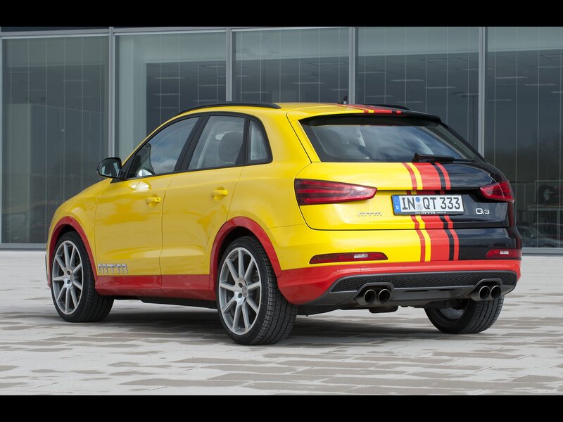 yellow audi q3 with racing stripes