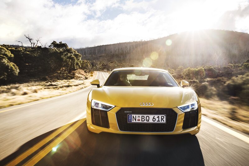 Yellow Audi R8 on a scenic road