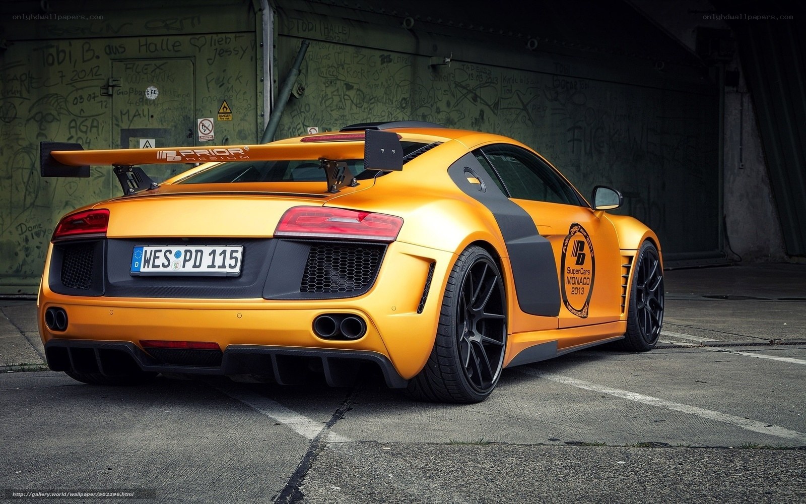 yellow audi r8 with rear wing