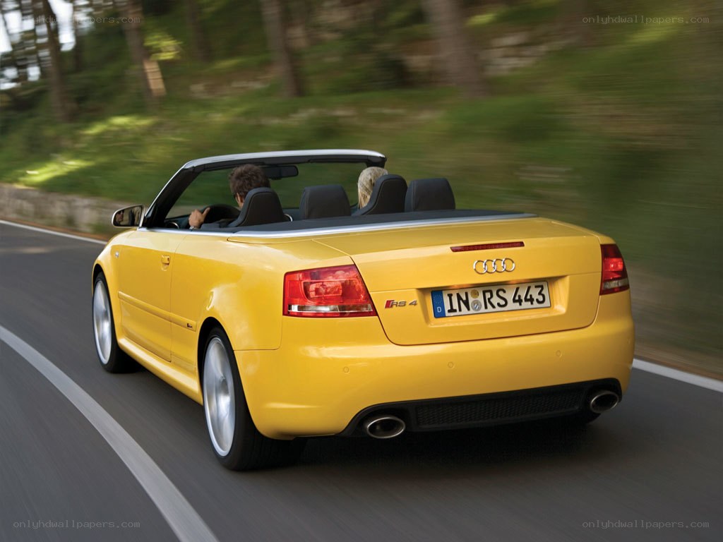 Yellow Audi RS4 convertible driving