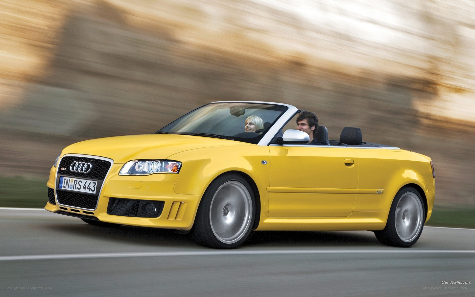 Yellow Audi RS4 convertible in motion
