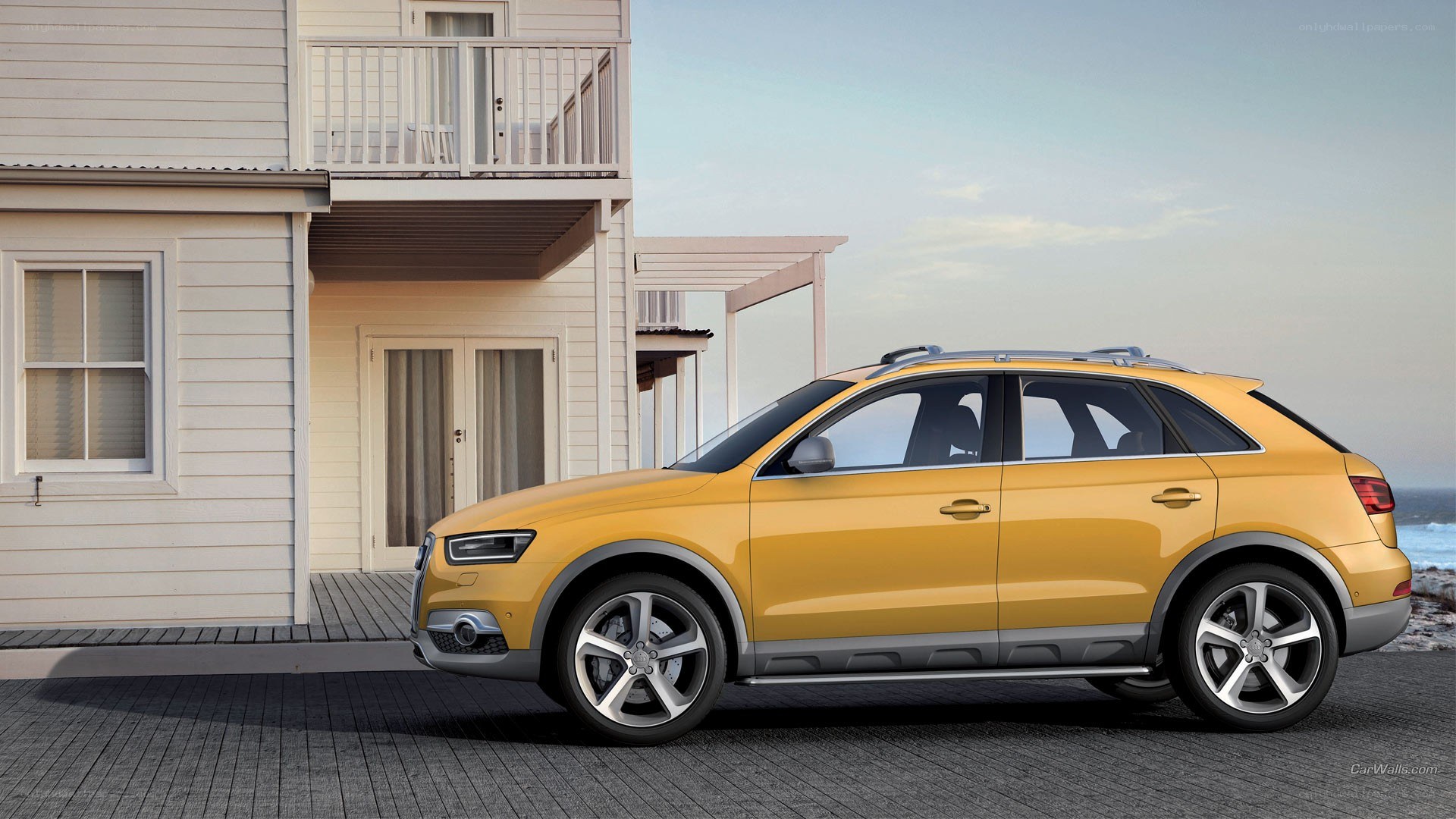 Yellow Audi SUV by the beach