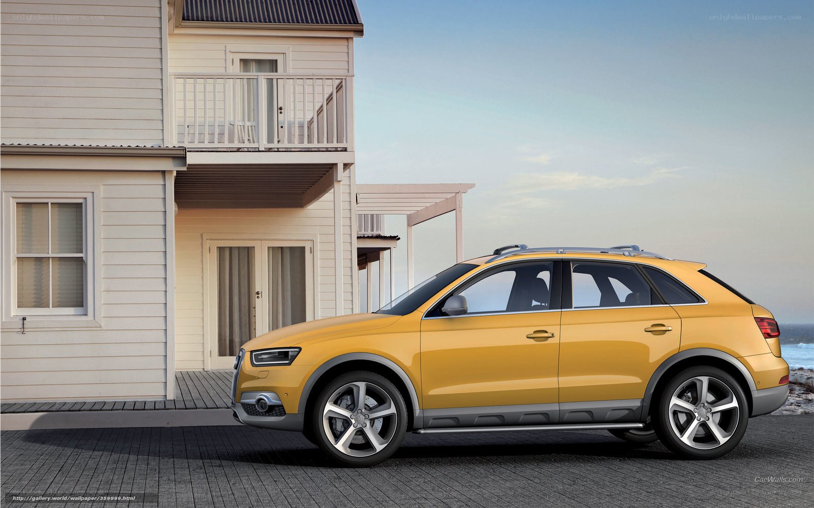 Yellow Audi SUV by the beach