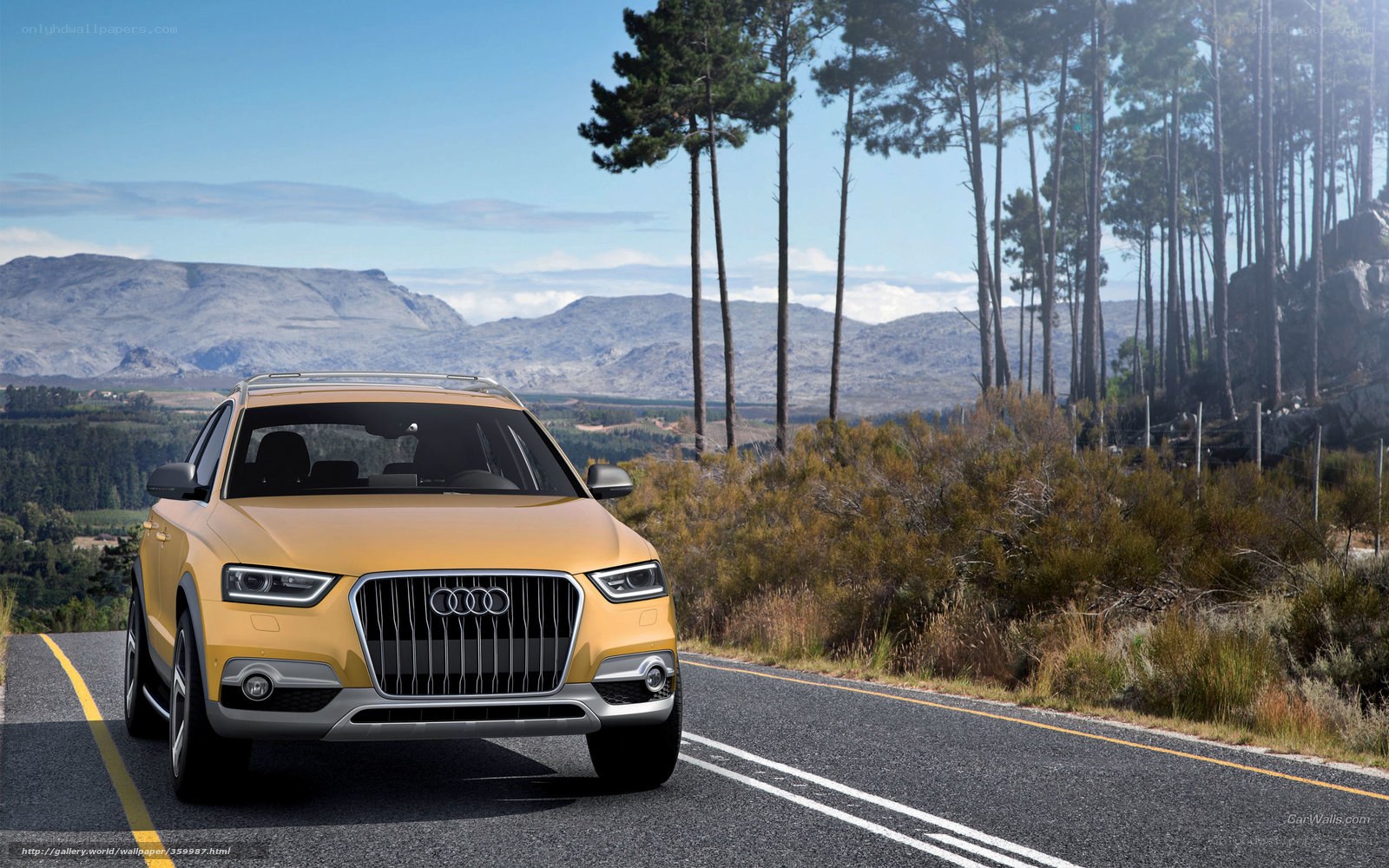 Yellow Audi SUV on a mountain road