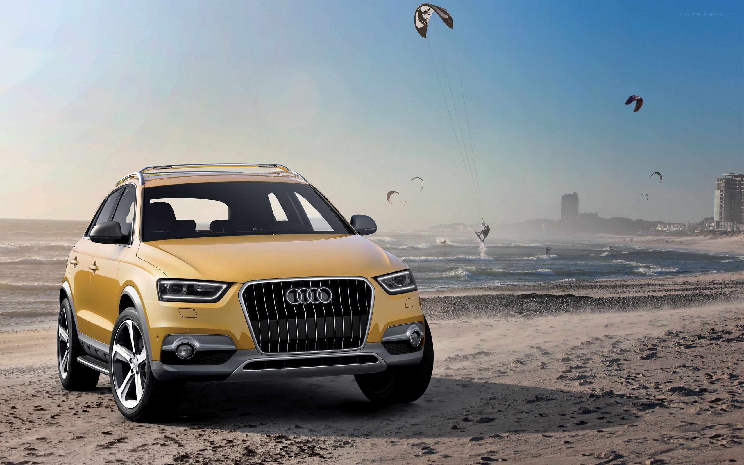 Yellow Audi SUV on beach