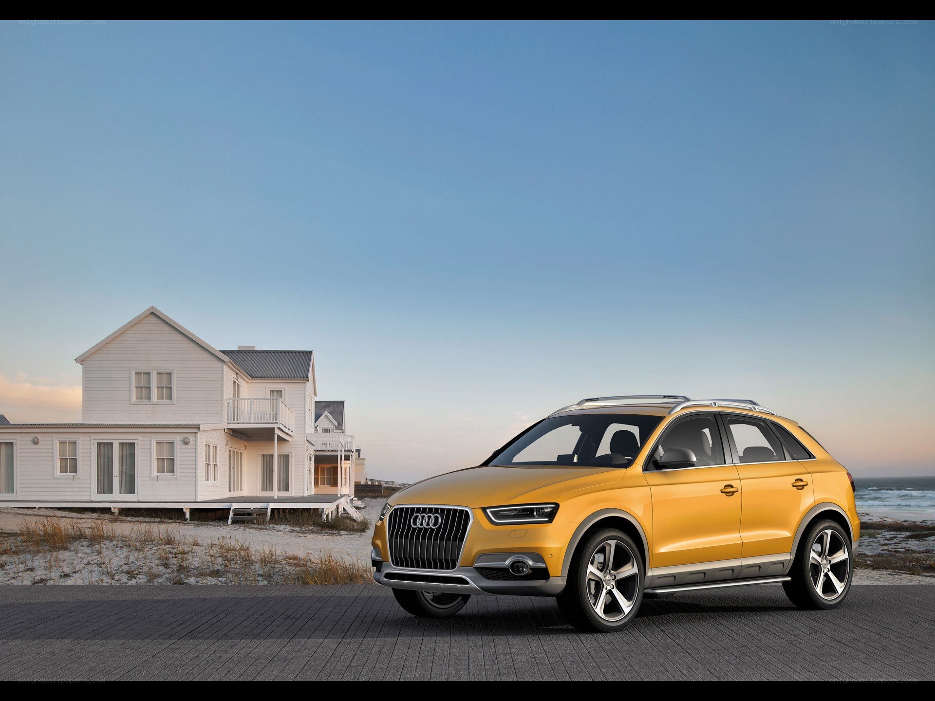 Yellow Audi SUV on beach