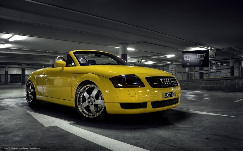 Yellow Audi TT in parking garage