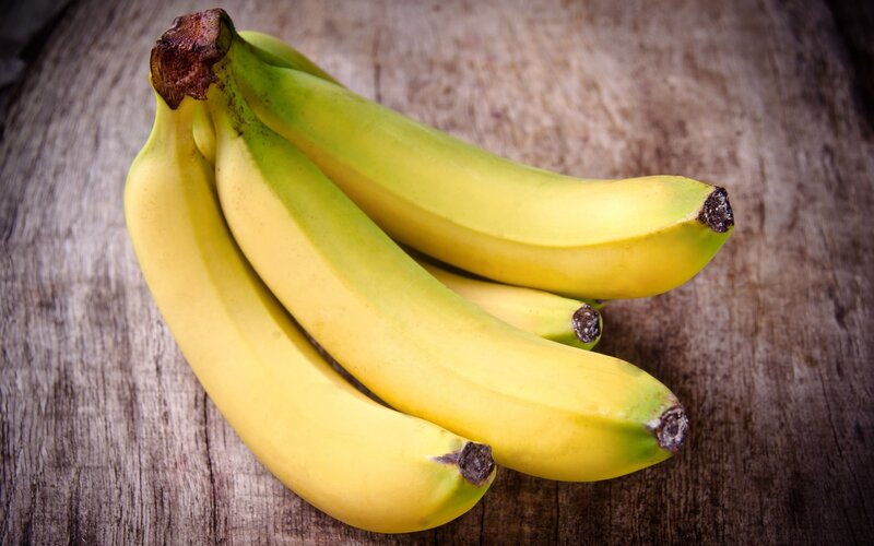 Yellow Bananas on Wood