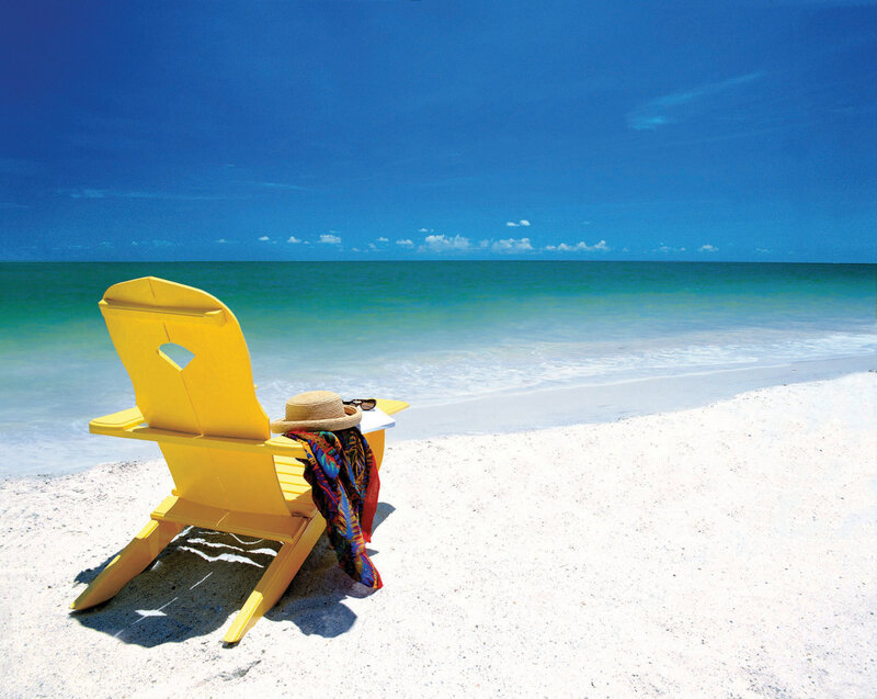 Yellow beach chair on sunny shore