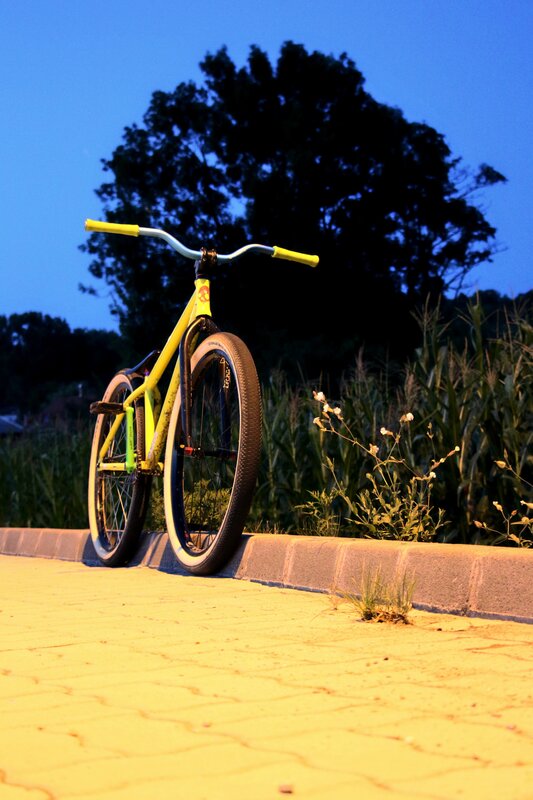 Yellow Bicycle on Curb