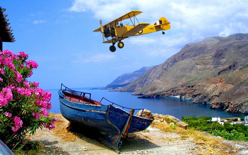 Yellow Biplane Flying — Blue, Serene