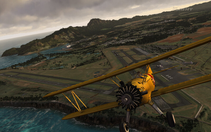 Yellow Biplane Flying