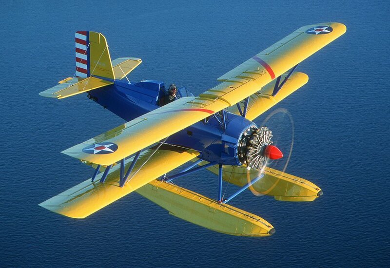 Yellow Biplane in Flight — Blue