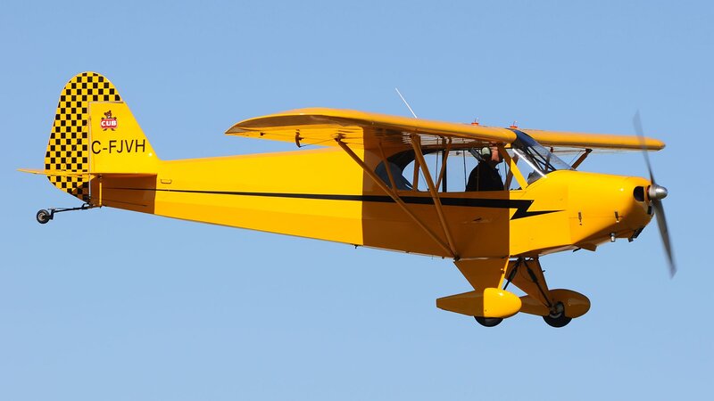 Yellow Biplane in Flight — Calm, Afternoon, Photograph, Pilot