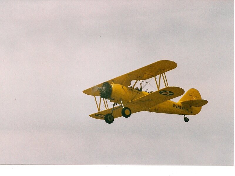 Yellow Biplane in Flight — Calm