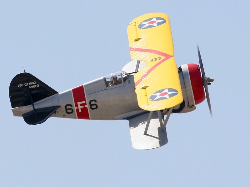 Yellow Biplane in Flight — Clear