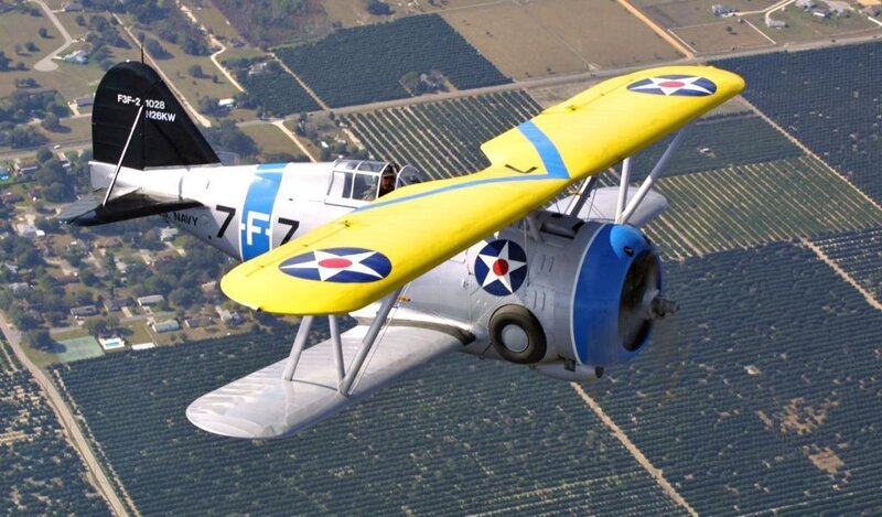 Yellow Biplane in Flight — Dynamic, Afternoon, Photograph