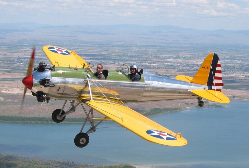 Yellow Biplane in Flight — Serene, Afternoon