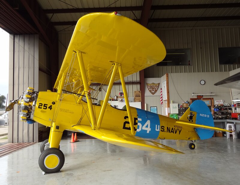 Yellow Biplane in Hangar