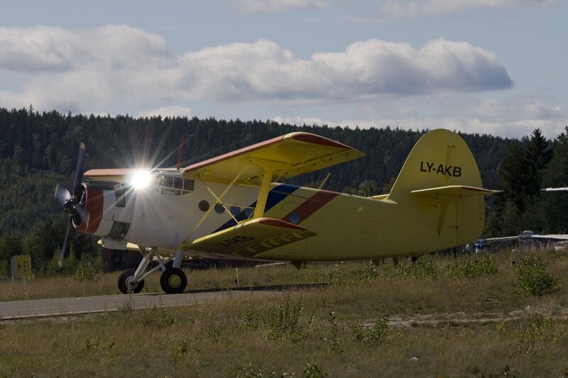 Yellow biplane on airfield