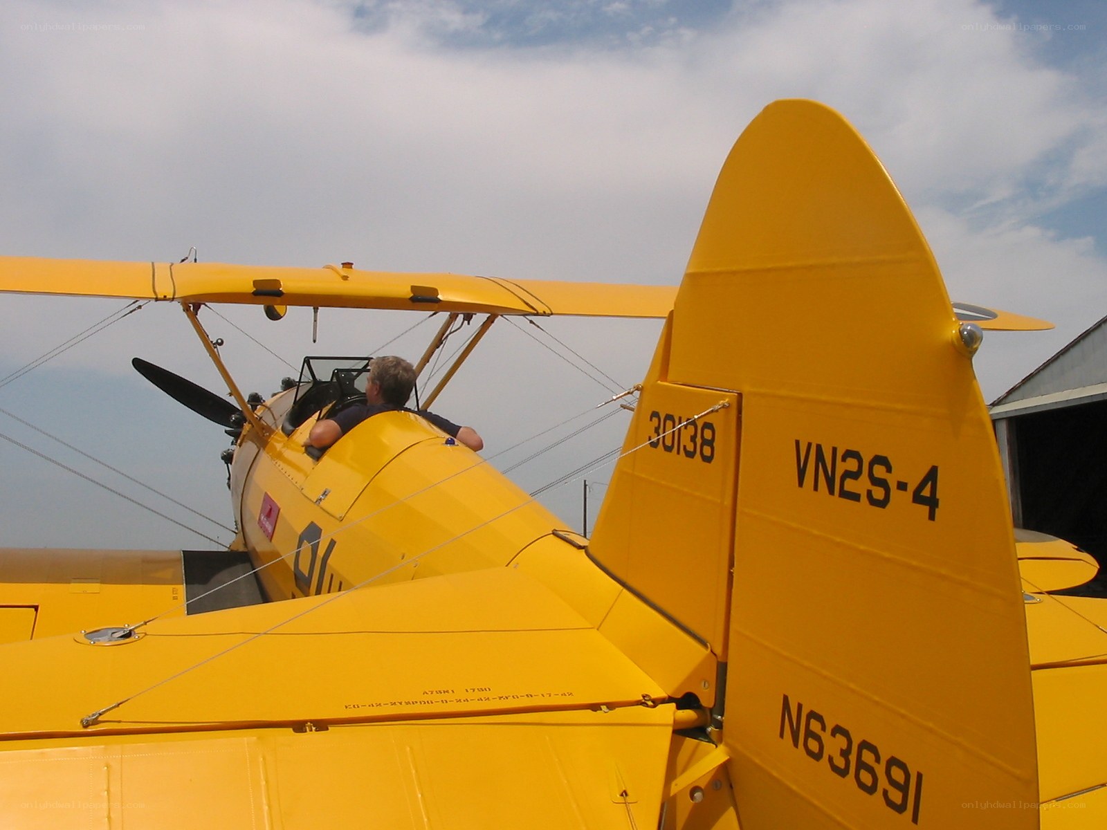 Yellow biplane on airfield