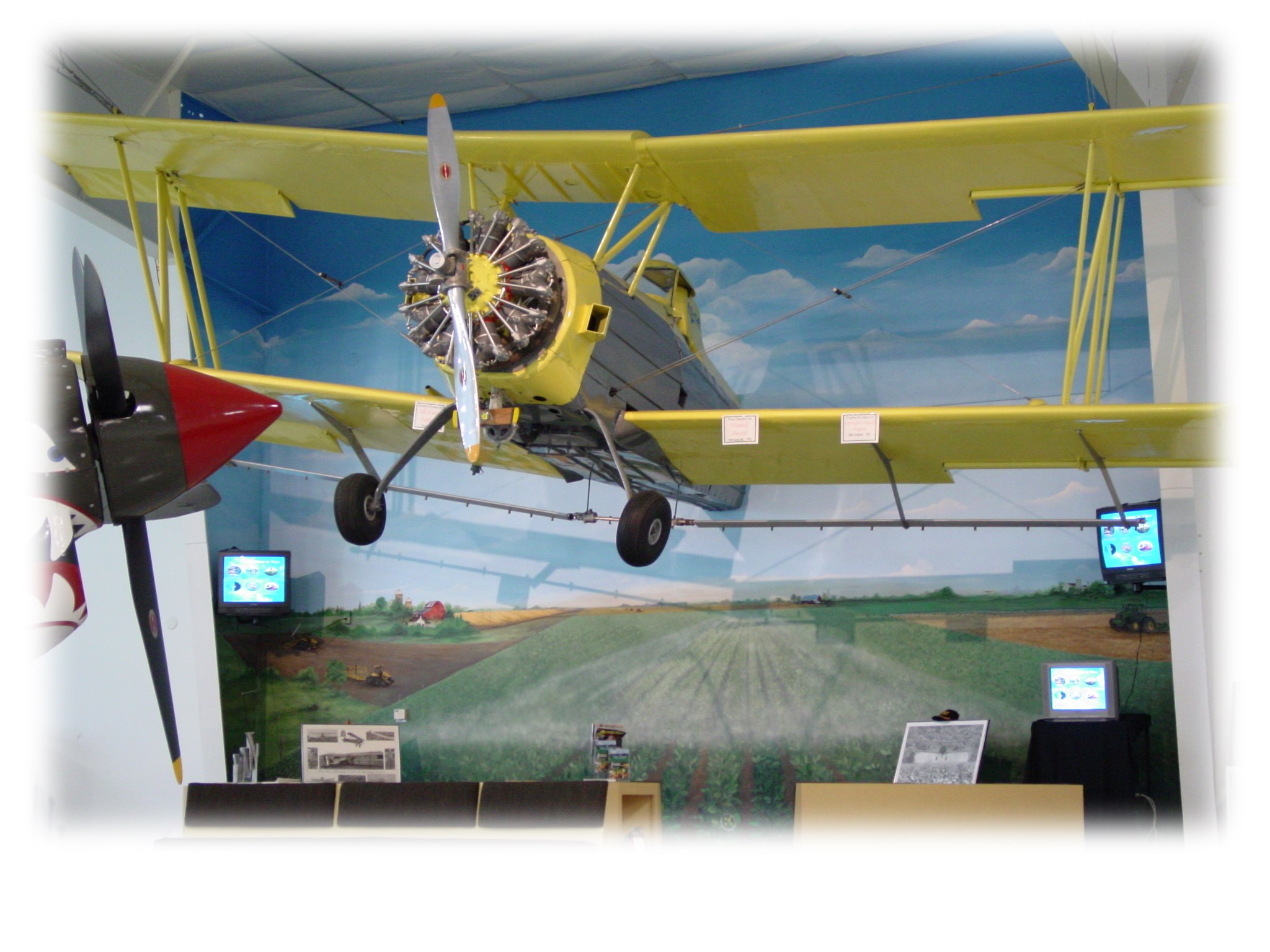 Yellow biplane on display