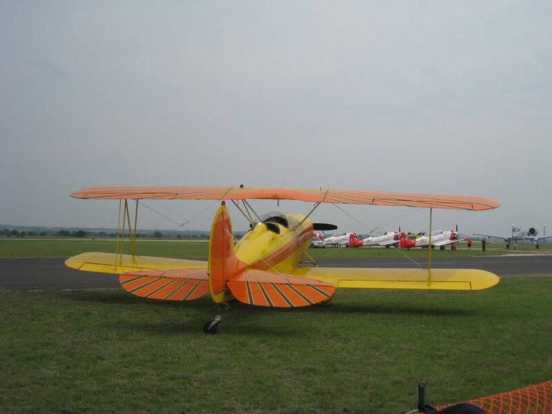 Yellow Biplane on Grass — Calm