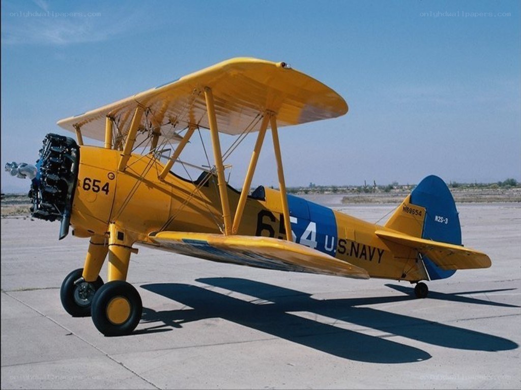 yellow biplane on tarmac