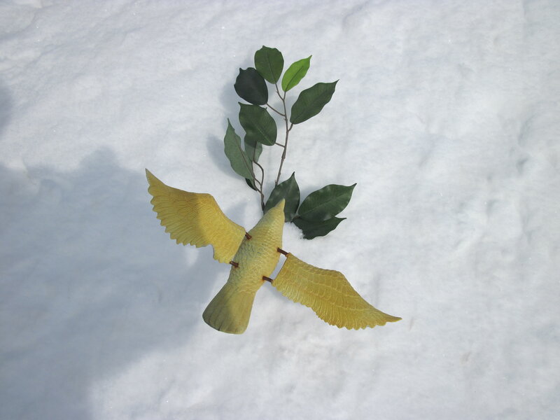 Yellow Bird Toy in Snow