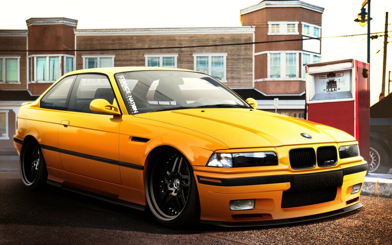 Yellow BMW at a gas station