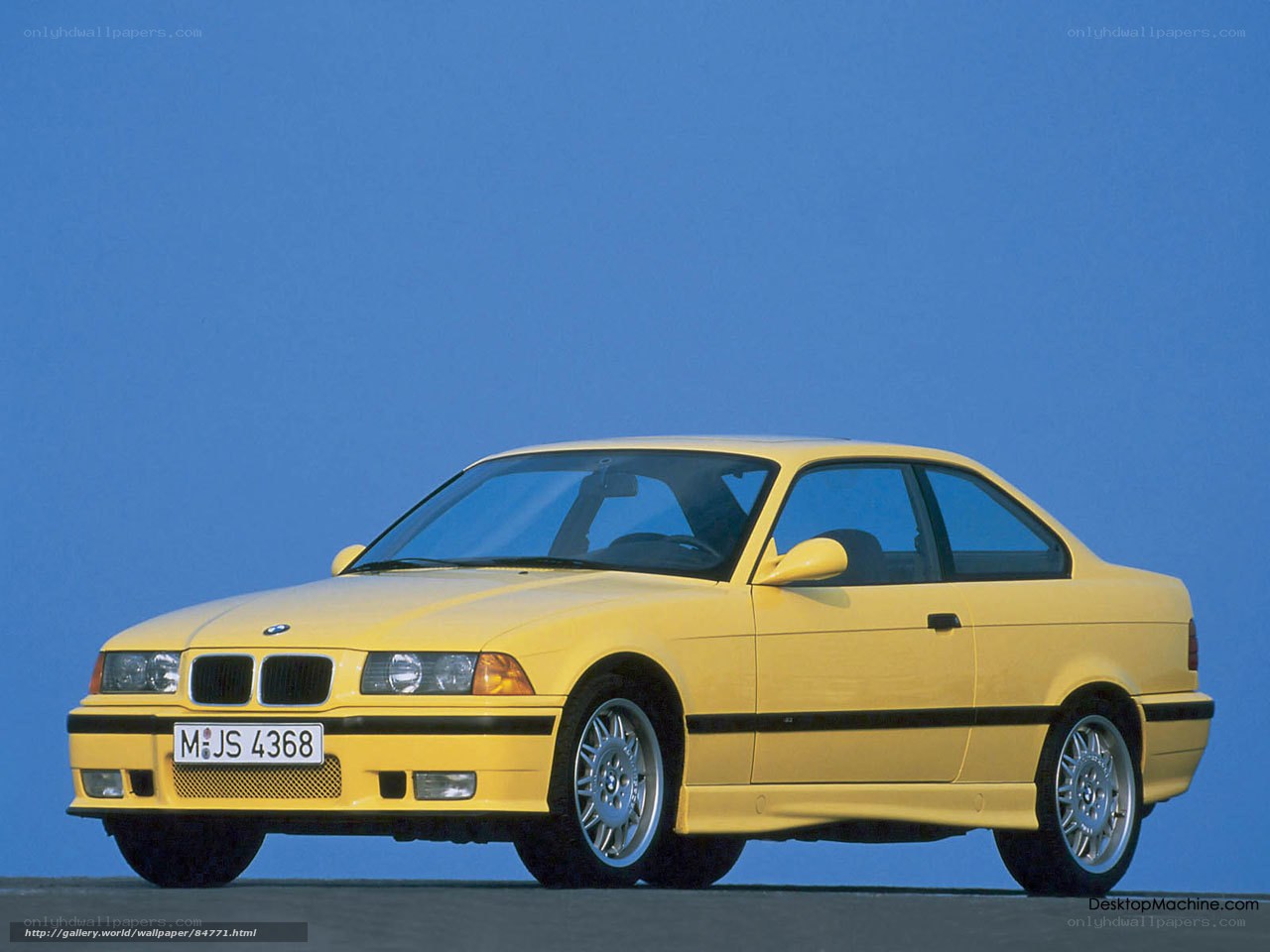 yellow bmw coupe car