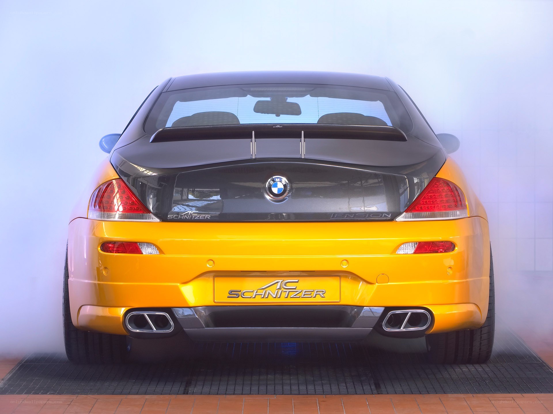 yellow bmw coupe rear view