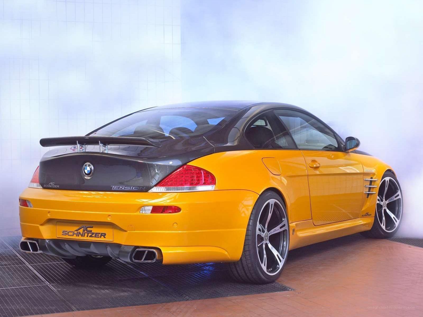 yellow bmw coupe with spoiler