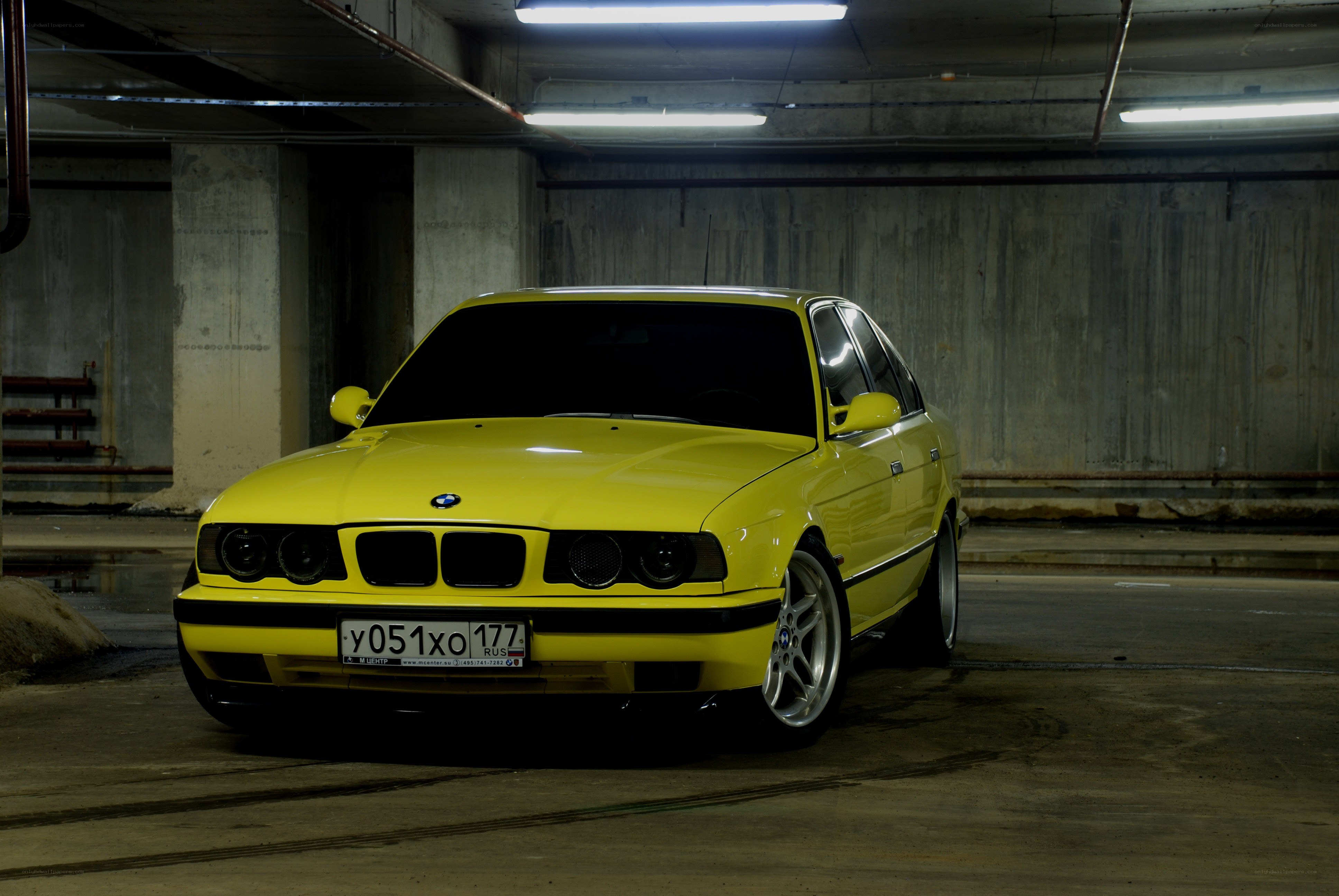 Yellow BMW in parking garage