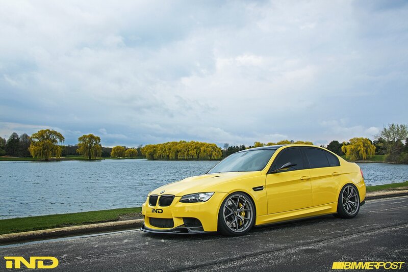 Yellow BMW M3 by a lake
