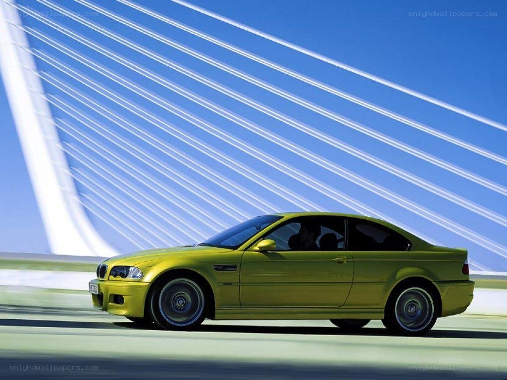 yellow bmw m3 on a bridge