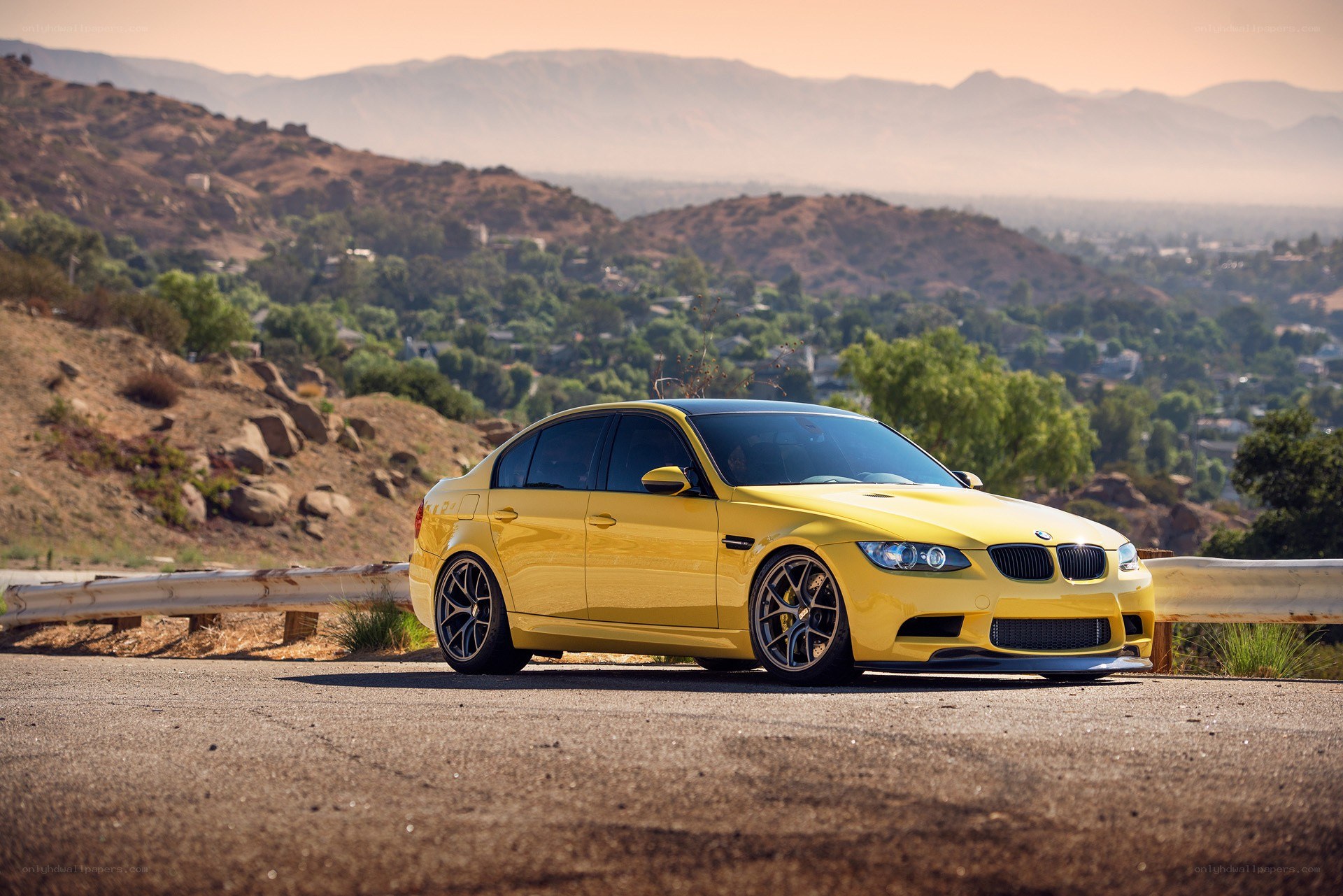 yellow bmw m3 on a hillside