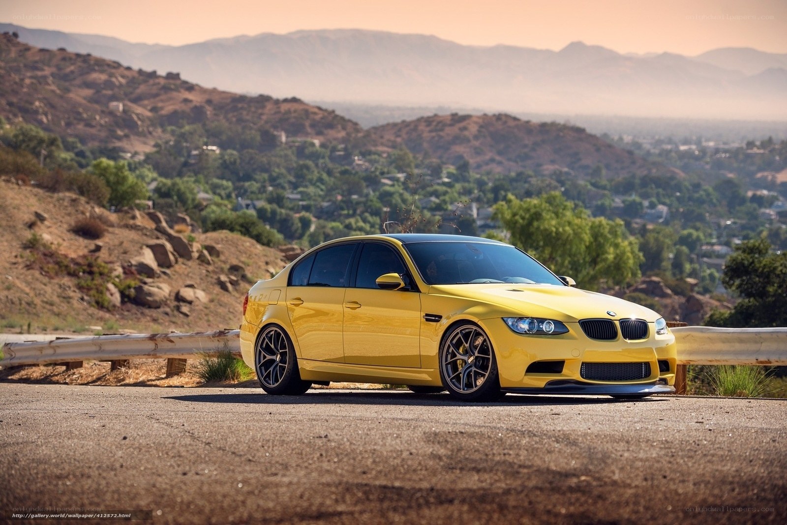 Yellow BMW M3 on a hillside