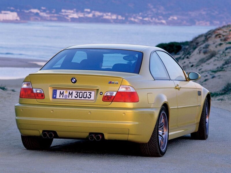yellow bmw m3 on coastal road