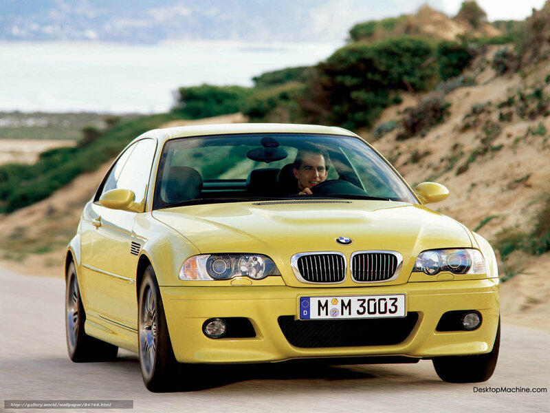 Yellow BMW M3 on coastal road