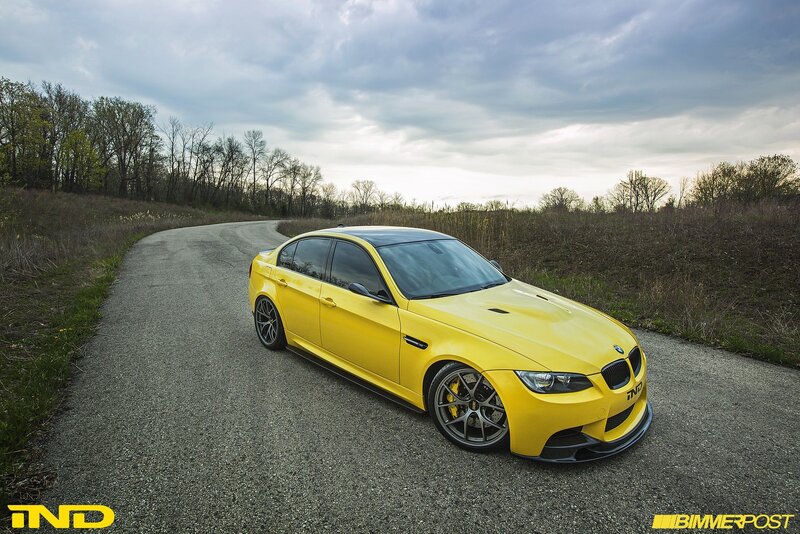 yellow bmw m3 on country road