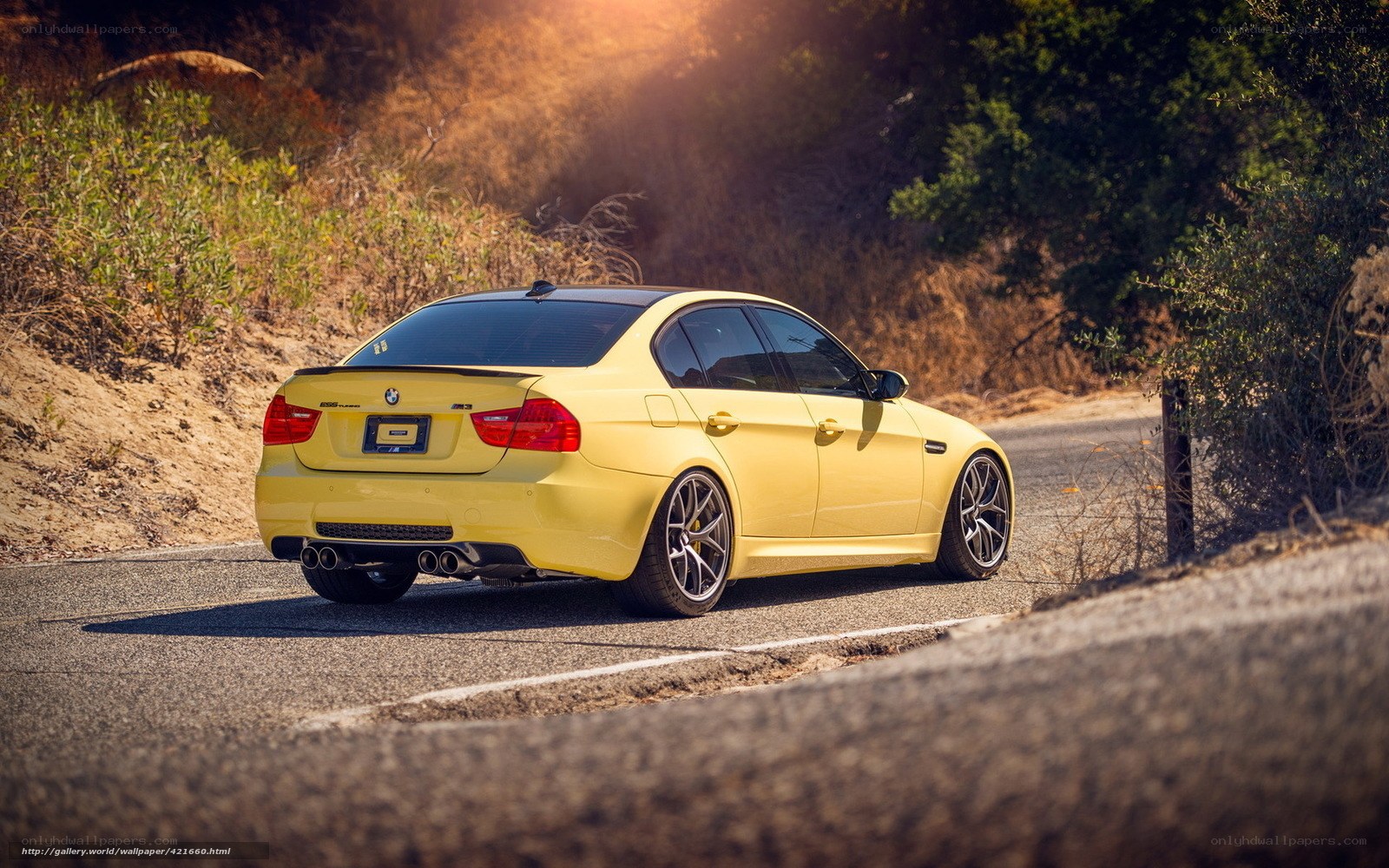 yellow bmw m3 on road