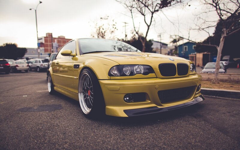 yellow bmw m3 parked on street