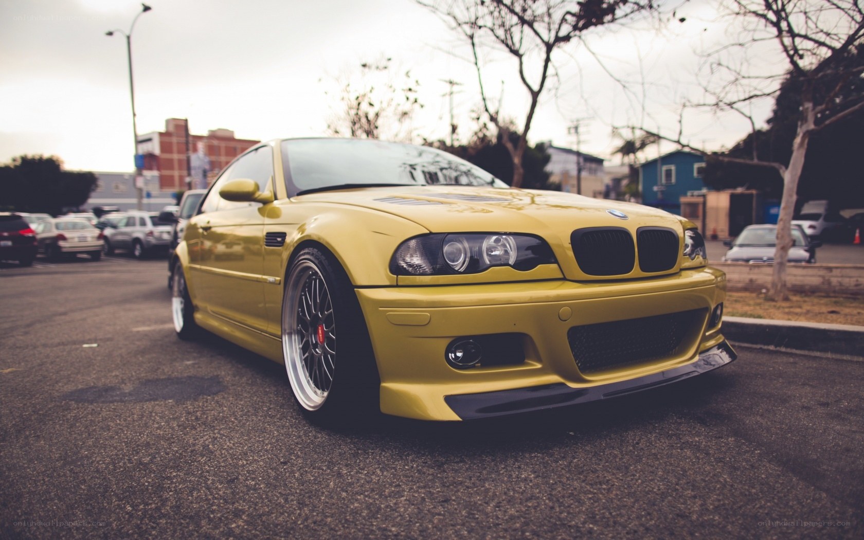 yellow bmw m3 parked on street