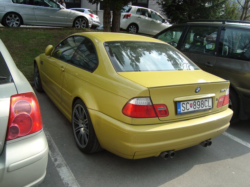 yellow bmw m3 parked